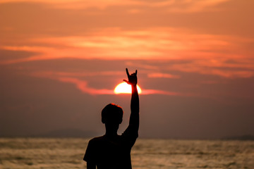 Silhouette Man is lifting love love hand.