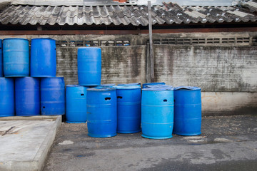 Plastic tanks or 200 liter plastic tank used as trash in a community area.