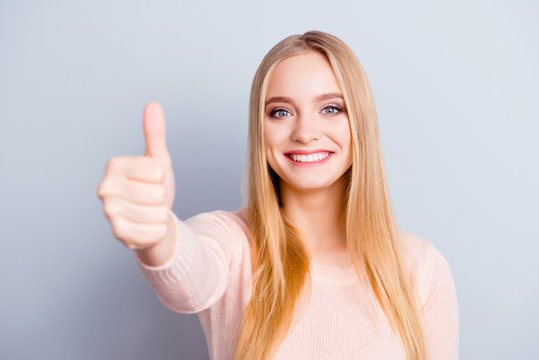 Casual emotion glamour employment perfect excited trendy recommend want person concept. Close up portrait of cheerful cute confident pretty girl demonstrating thumb-up symbol isolated gray background
