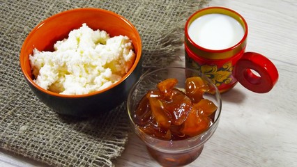 Cottage cheese with Apple jam on a background of burlap.