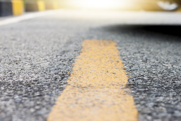 Parking sign of yellow line mark on the road for control cars with footpath.