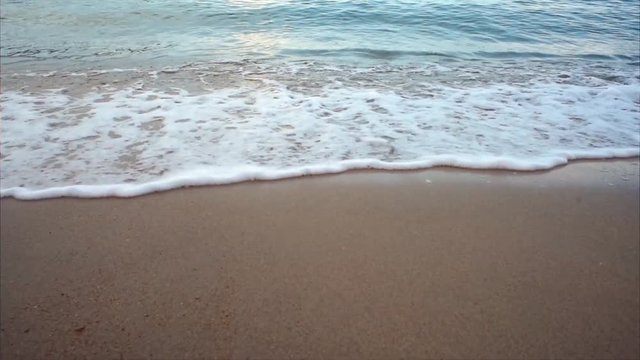 soothing beach waves scene footage on sandy beach. holiday and tranquility concept. beach located in Pangkor Island, perak, malaysia