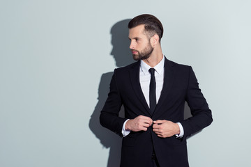 Attractive, virile, harsh, stunning, cool business person in classy outfit with turned half face,...