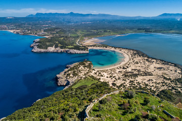 Obraz premium Panoramic aerial view of voidokilia beach, one of the best beaches in mediterranean Europe, beautiful lagoon of Voidokilia from a high point of view, Messinia, Greece