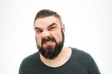 Closeup portrait of angry, mad, annoyed, skeptical, grumpy man, employee, worker isolated on white...