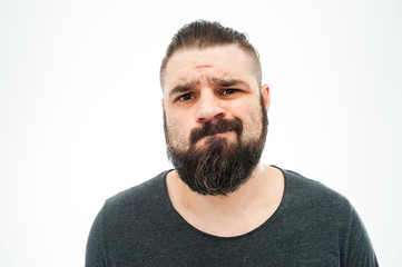 Closeup portrait of angry, mad, annoyed, skeptical, grumpy man, employee, worker isolated on white...