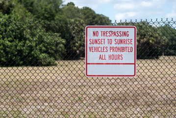 No Trespassing Sunset to Sunrise Sign