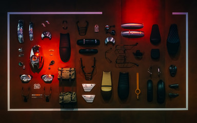 Obraz premium Display of motorcycle Accessories and spare parts arrangement hanging on wooden wall for motorcycle fashion decoration