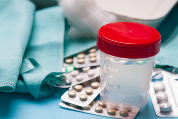 Plastic container, drugs and cotton wool 