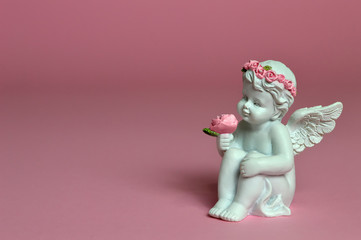 Angel holding flowers