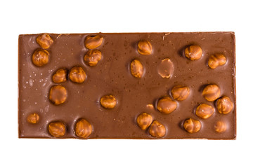 Dark chocolate with hazelnuts isolated on a white background