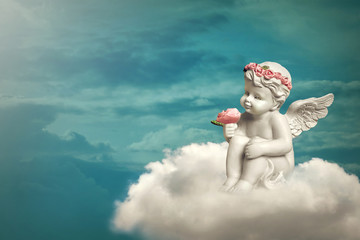 Angel sitting on the cloud
