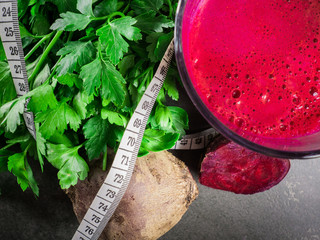 Fresh vegetables, glass with juice and meter.