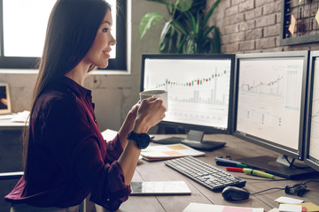 Monday morning work. Happiness trader drink hot coffee, toothy smiling