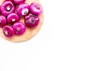 Red onion for salads on white background top view copy space