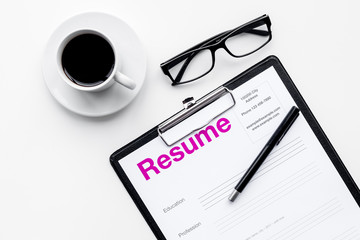 Resume of applicants near coffee, glasses on white background top view