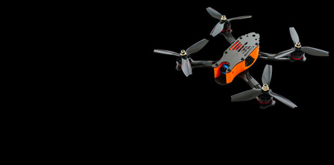 drones racing FPV quadrocopter made from soot, drone ready for flight, stylish and modern hobby. on a black background banner or advertisement