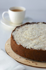 coconut cheesecake with a cup of tea