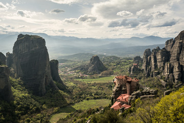 Fototapeta na wymiar Monastery on the edge of the rock in the unique meteora valley