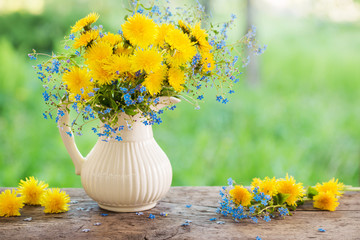 bouquet with forget-me-not and dandelions