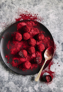 Raw Bliss Balls: Coconut, Almonds, Coconut Oil, Vanilla, Beetroot Powder, Coated With Beetroot Powder And Freeze Dried Raspberry Powder.