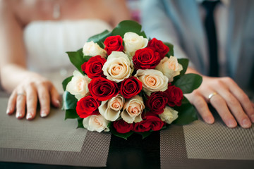 Bridal bouquet. Wedding. Beautiful bouquet with roses flowers at white, red colour, decorated with...