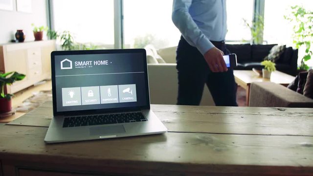 A man and a tablet with smart home screen.
