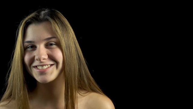 Frowned woman with bare shoulders