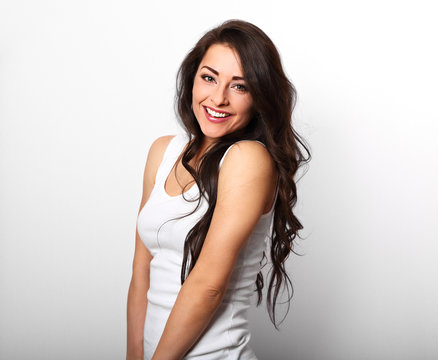 Beautiful Positive Happy Laughing Woman In White Shirt With Toothy Smile Holding The Hand The Long Brown Hair On White Background.