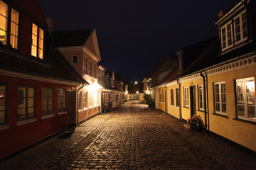 Fototapeta na wymiar Old fairy tale houses in a centrum of Odense in night