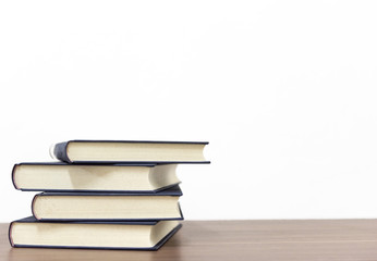 book on wooden table on bright background