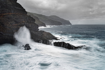 Strong surf on a rocky coast in stormy weather, water movement in long exposure - Location: Spain, Canary Islands, La Palma