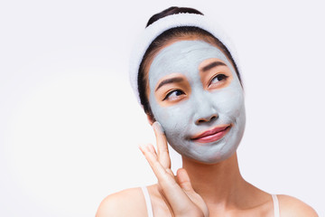 A woman is marking a face.