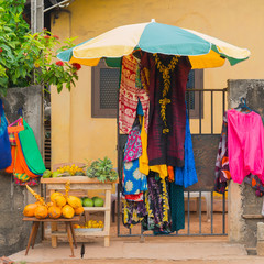 Sale of clothes and fruits on the street.