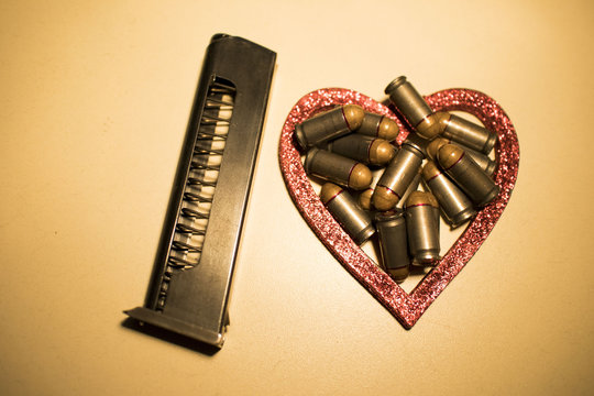Red bullet shotgun cartridges in tin heart shape tin box. Gift for real man.