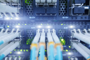 Fiber optic equipment in a data center. Close up fiber optic cable. 