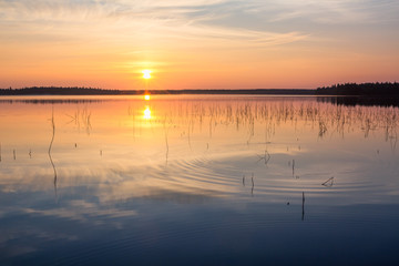 Fototapeta na wymiar Beautiful sunrise on the lake