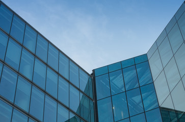 Obraz na płótnie Canvas Glass facade, modern architecture with blue sky, morning shoot