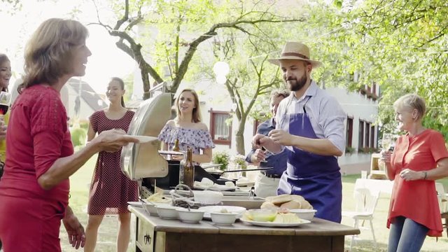 Family celebration or a barbecue party outside in the backyard.