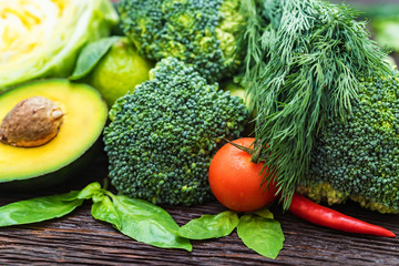 Fresh vegetables, lime and avocado close