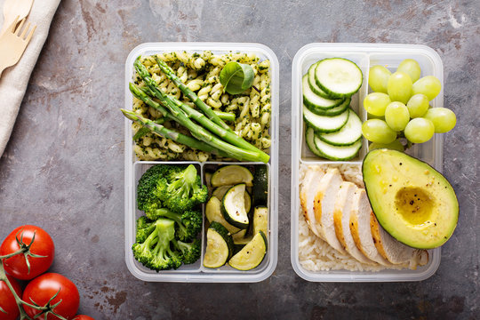 Green and healthy meal prep containers with chicken and vegetables