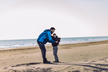 Father and son have fun on beach