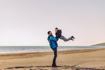 Father and son have fun on beach