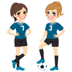 Two beautiful soccer girl players with black and blue uniform