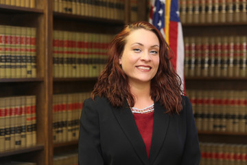  Portrait of a Professional Business Woman, an attractive female attorney in law library.