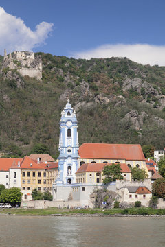 View over Danube River to Collegiate church and castle ruins, Durnstein, Wachau, Lower Austria