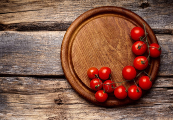 cherry tomatoes on wooden  background