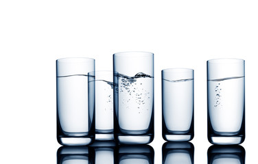 Conceptual illustration of water wave and bubbles seen through water glasses on white