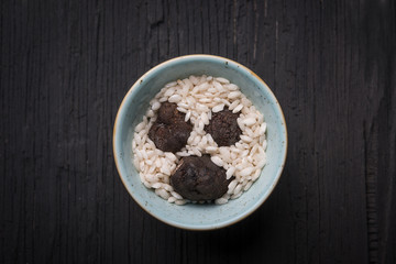 Top view of plate with black truffle mushroom with rice