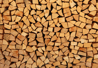 background of many stacked wooden logs